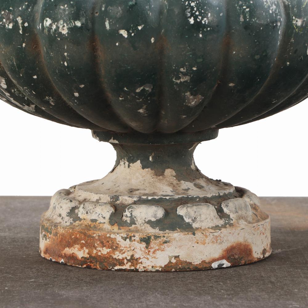 Each of bulbous, semi-lobed form, featuring gently flared rims and set on circular bases. The design evokes traditional neoclassical styling, with an emphasis on elegant curvature and robust craftsmanship.