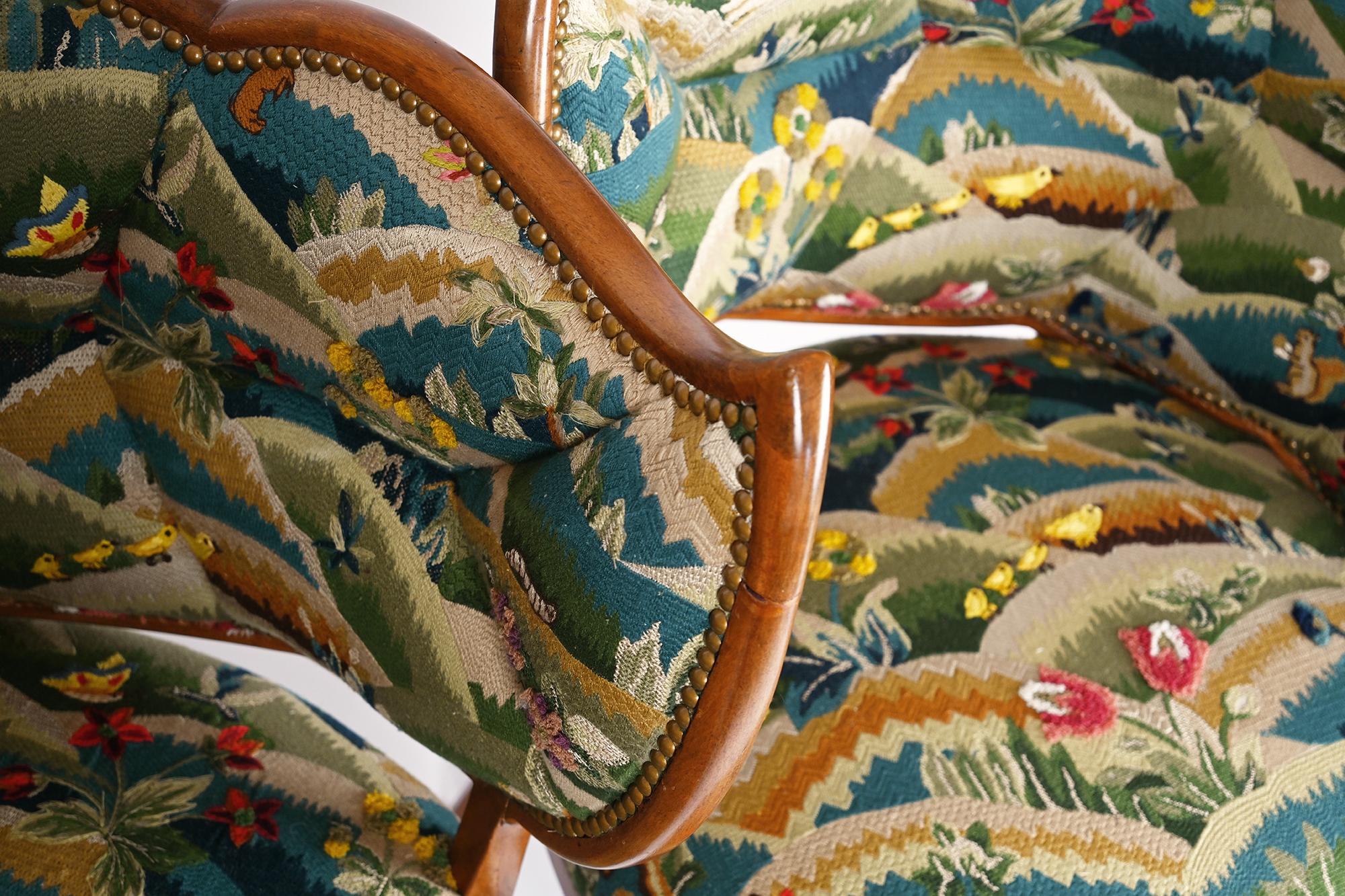 Hand-Carved A Pair of French Tapestry Upholstered Open Armchairs For Sale