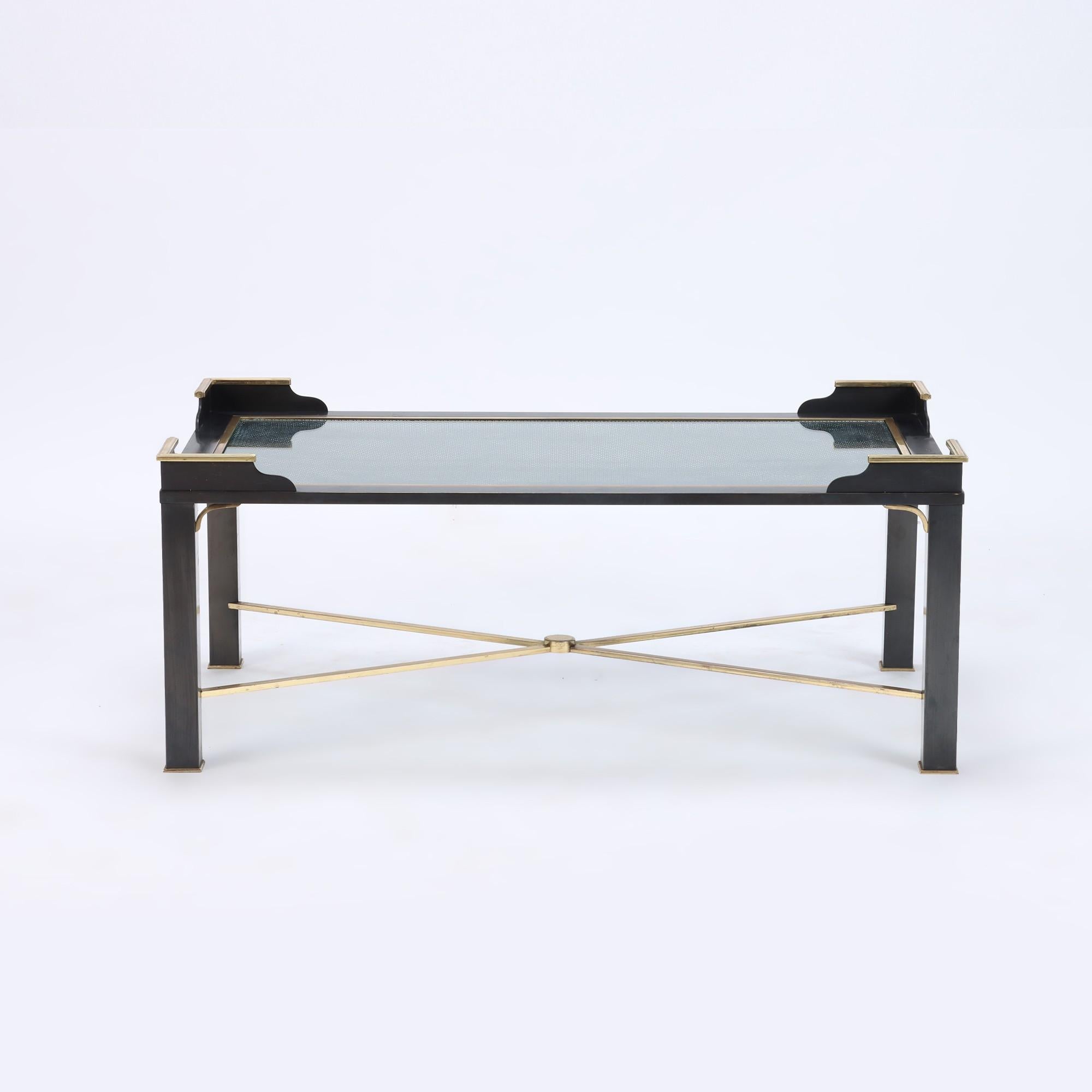 A very rare pair of two tone bronze coffee tables attributed to Jansen, having glass tops over brass mesh details. C 1970.