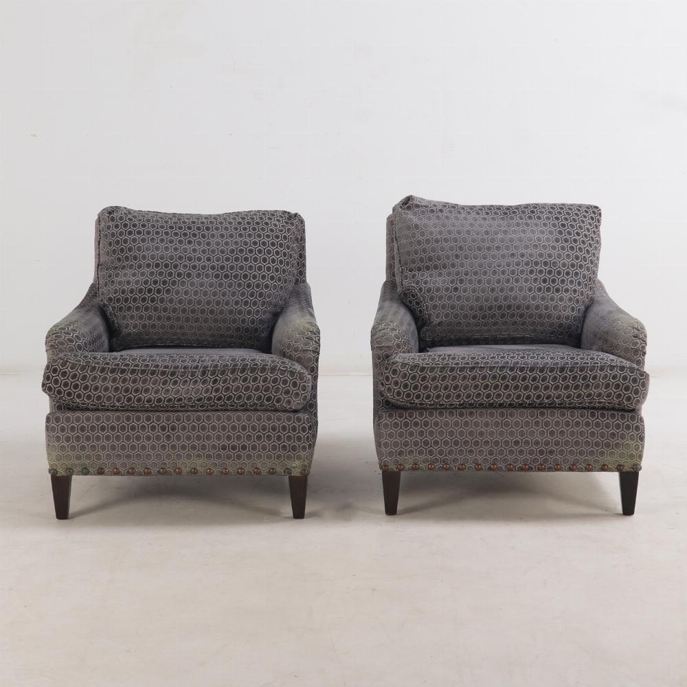 This wonderful pair of chairs have square backs, rolled arms, and rolled metal studs. The new fabric make them a perfect neutral addition to your study, living room or bedroom.
