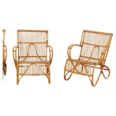 A Pair of French Vintage Bent Cane Patio Chairs with Fluid Shapes