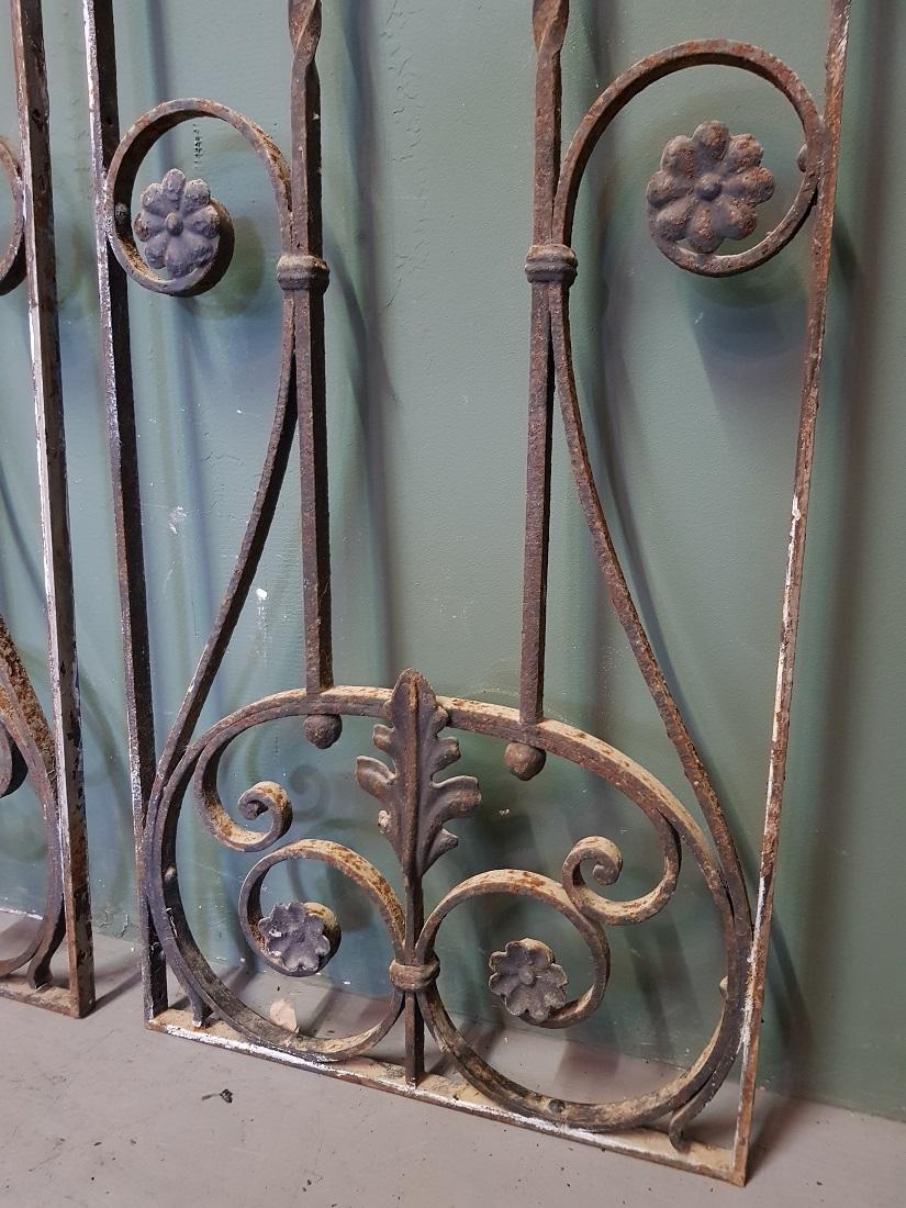 Set old French wrought iron door grilles decorated with twisted and curled elements, both are in good but used condition. Originating from the 1st half of the 20th century.

The measurements are,
Depth 2 cm/ 0.7 inch.
Width 34 cm/ 13.3