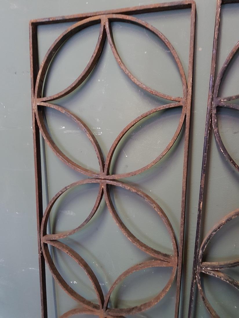 A pair of vintage French wrought iron door grilles decorated with diamonds and circles, both are in good but used condition. Originating from the second half of the 20th century.

The measurements are,
Depth 2 cm/ 0.7 inch.
Width 31 cm/ 12.2