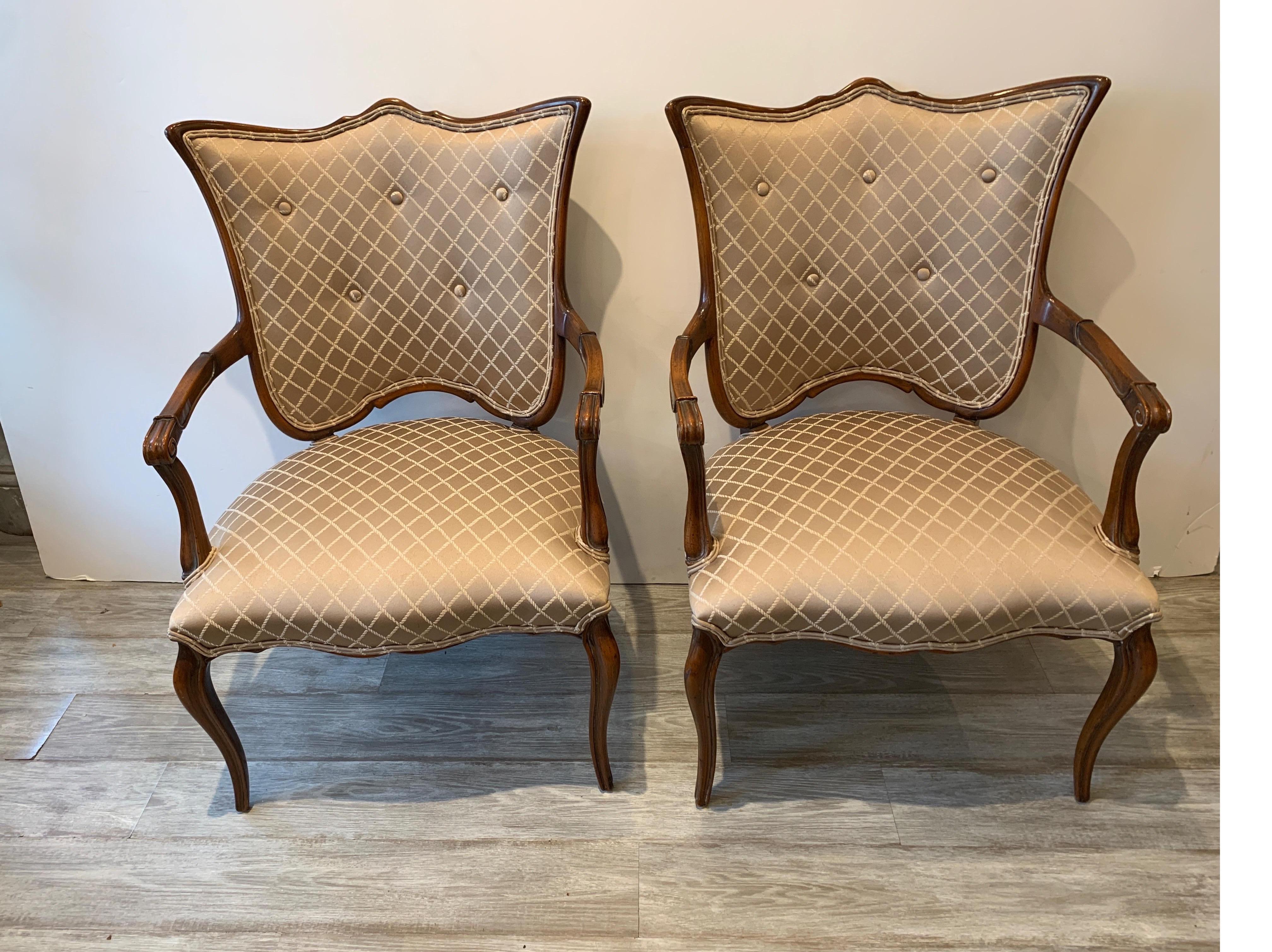 A shapely pair of fruitwood armchairs with open arms. The shield fanned backs with attached seats in a newly upholstered lattice pattern damask fabric.