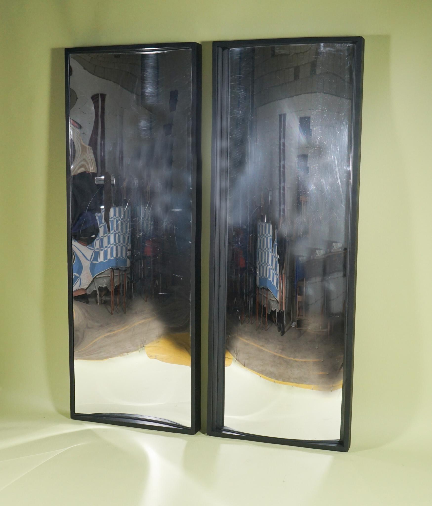 This large pair of fun house mirrors comes from the estate of famed designer Mario Buatta. He clearly had a love of these because a number of them in different sizes and shapes where featured among his personal property. Made in tempered acrylic and