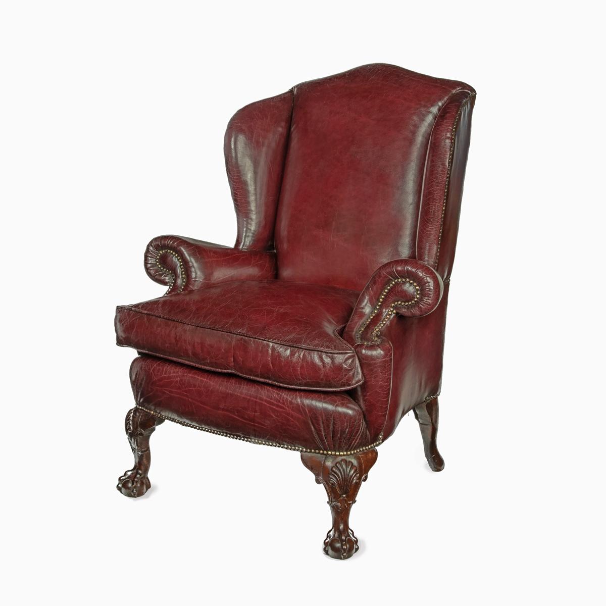 A pair of generous mahogany wing armchairs with shell carved knees For Sale 1