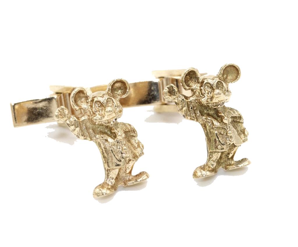 A pair of Gentleman's 14 Kt Yellow Gold Micky Mouse Cufflinks with Micky in classic pose waving his right hand. With swivel bar fitting.
Stamped Walt Disney Prod. to the reverse.
Stamped 14k
Micky stands 1.7cm tall