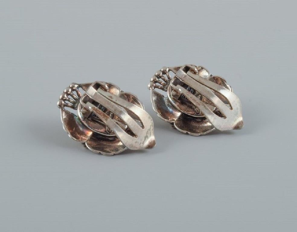 Women's A pair of Georg Jensen ear clips in sterling silver.  For Sale