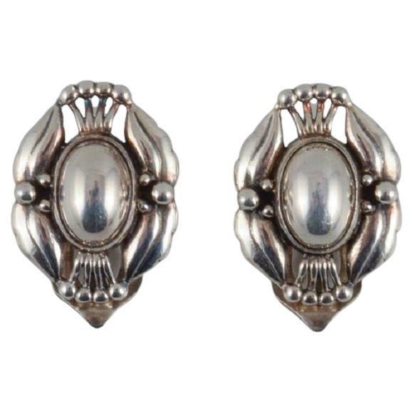 A pair of Georg Jensen ear clips in sterling silver.  For Sale