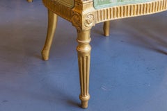A pair of George 111 period gilt armchairs