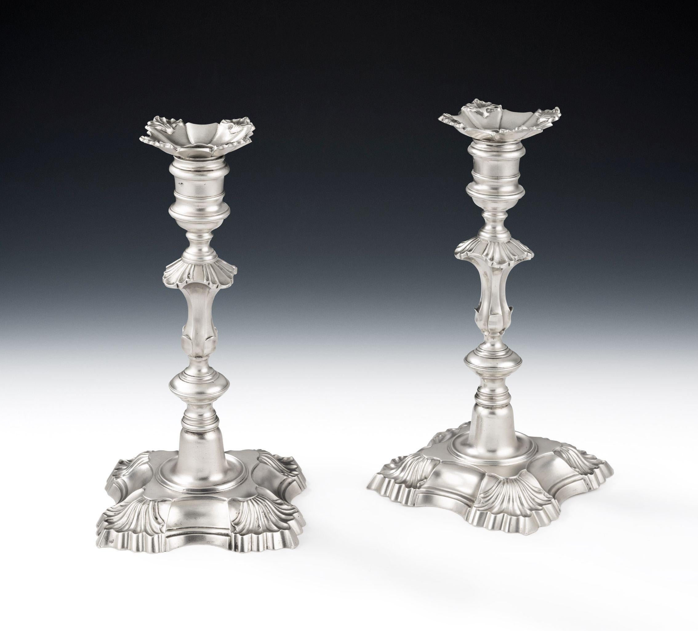 A VERY FINE & SUBSTANTIAL PAIR OF GEORGE II CAST CANDLESTICKS MADE IN LONDON IN 1748 BY WILLIAM GOULD.

The Candlesticks are cast and modelled in a much larger version of this style than is usually seen at this date. Each stands on a shaped foot