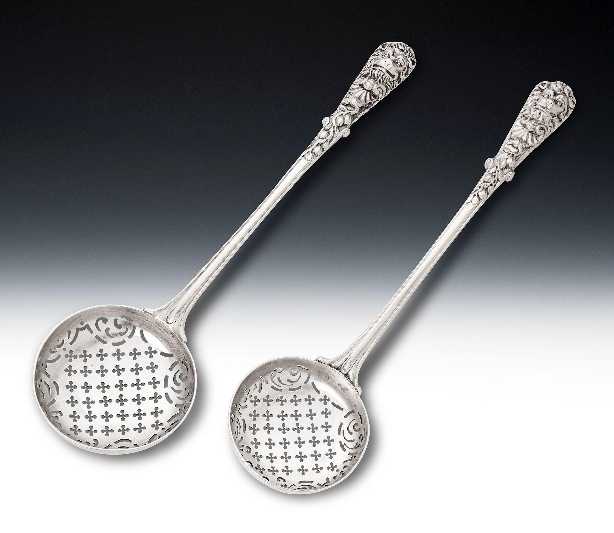 AFTER PAUL DE LAMERIE
A VERY RARE PAIR OF GEORGE II GRADUATED CAST SIFTER SPOONS
UNUSUALLY MODELLED IN A SERVING SPOON SIZE
MADE IN LONDON IN 1754/55 BY WILLIAM CRIPPS

The cast Sifter Spoons are the largest we have ever offered and are modelled in