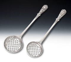 A pair of George II Cast Sifter Spoons, London, 1754/55 by William Cripps.