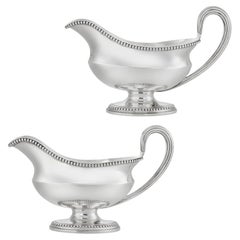 A pair of George III silver sauce boats by Andrew Fogelberg