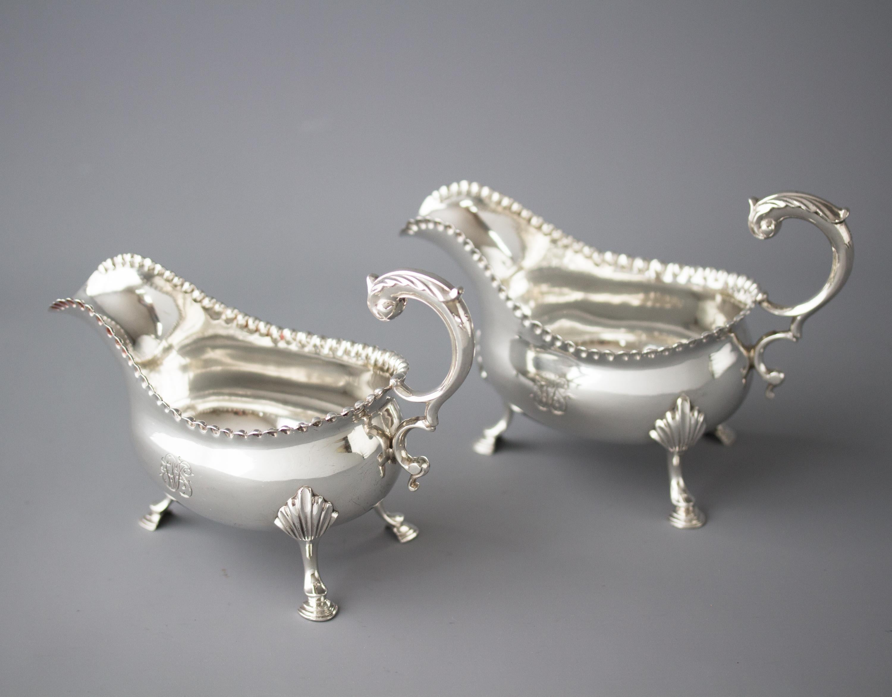 English A Pair of George III Silver Sauce Boats, London 1768 by W & J Priest For Sale
