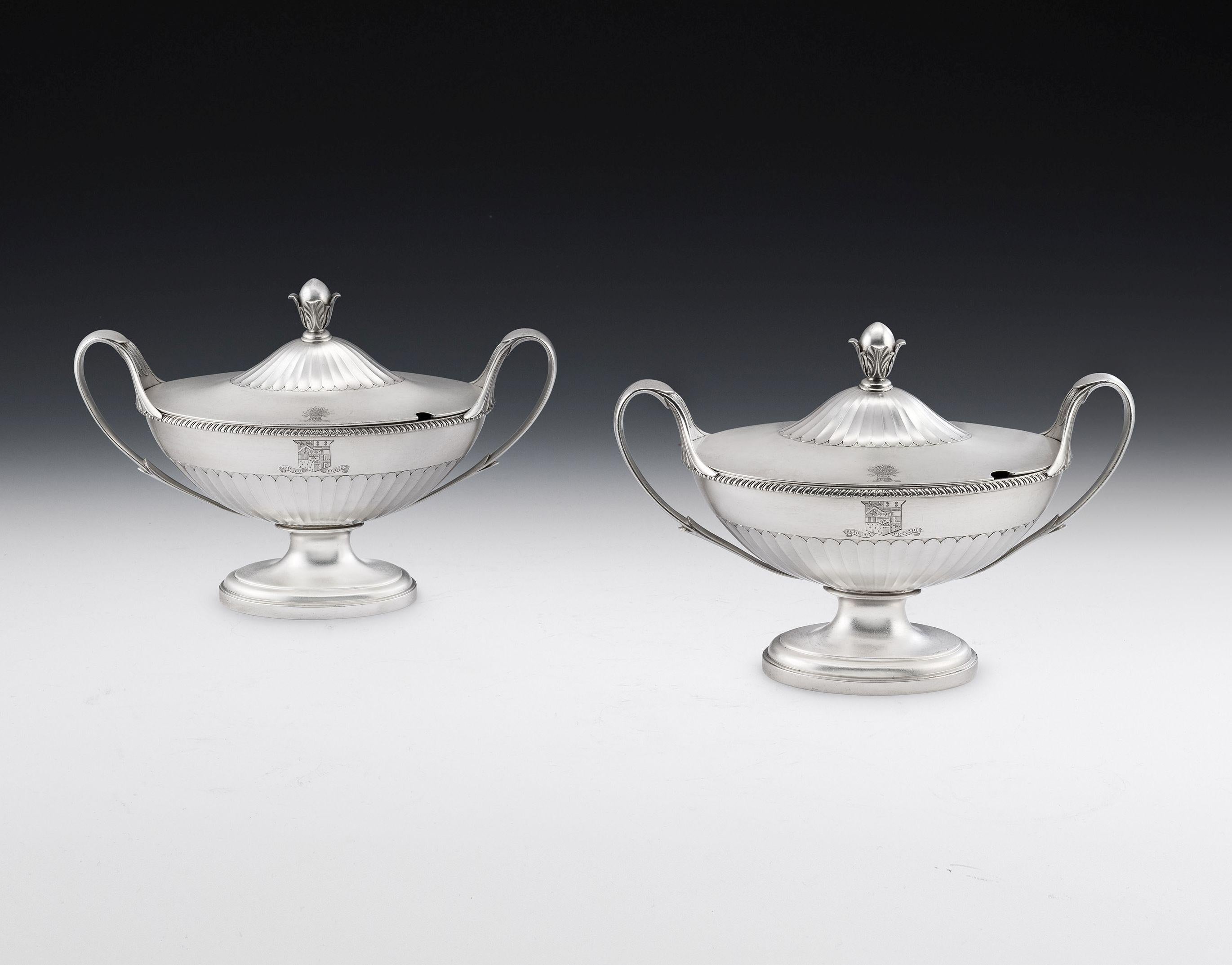 These exceptional antique sterling silver Sauce Tureens are boat shaped in form and stand on an oval pedestal foot decorated with reeding. The lower section of the main body is decorated with flat fluting and the rim with gadrooning. Each piece has