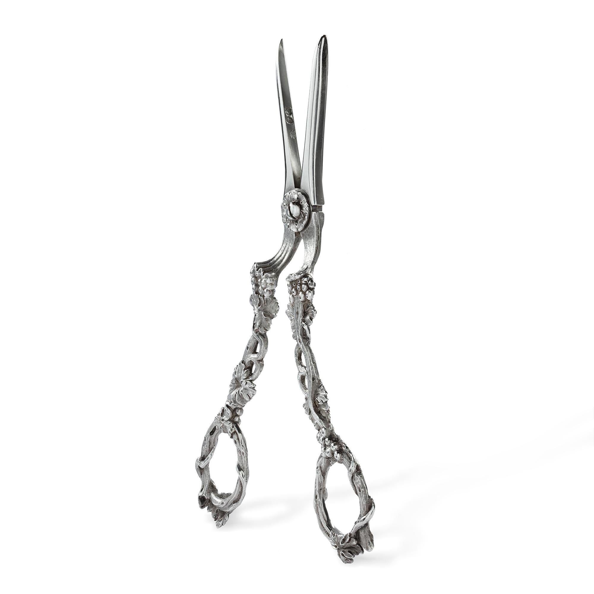 A pair of George IV silver grape scissors, with cast grape and vine handles, 19cms long, hallmarked London 1829, maker Charles Reily & George Storer.

Should you choose to make this purchase we would be delighted to send it to you in a gift-wrapped