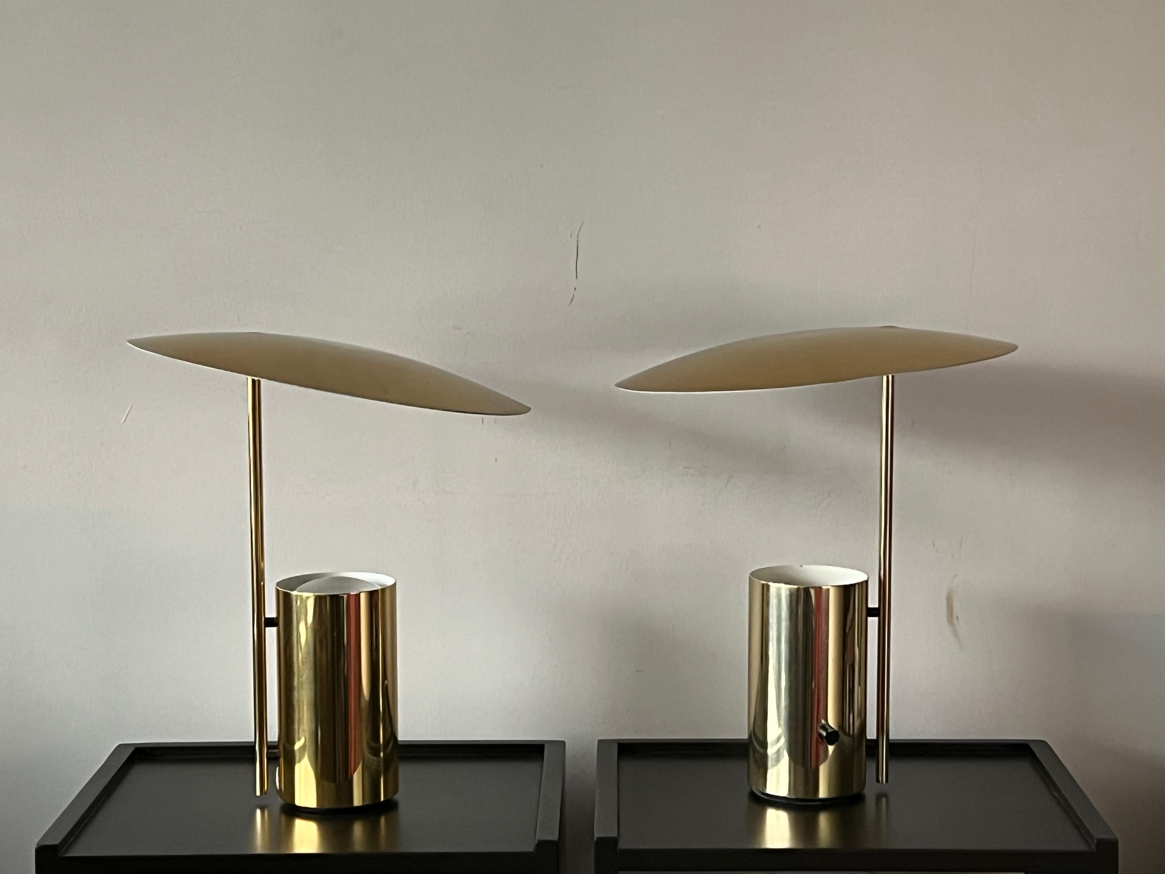 A classic pair of George Nelson Half lamps for Koch Lowy. In brass finish. Very good overall conditon. One shade has a small dent.