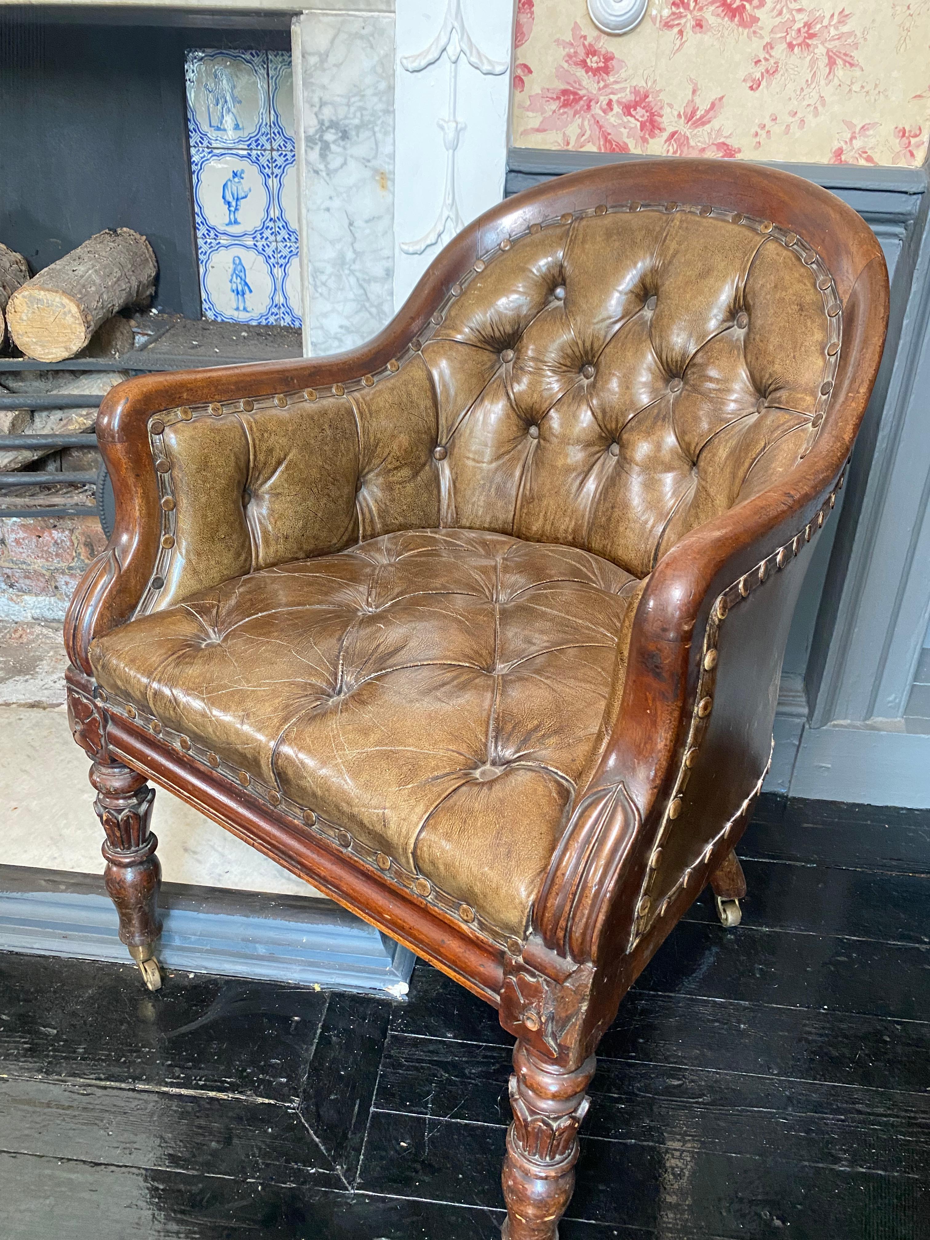 A wonderful and original pair of Georgian Library Tub chairs, beautifully patinated leather and studding.