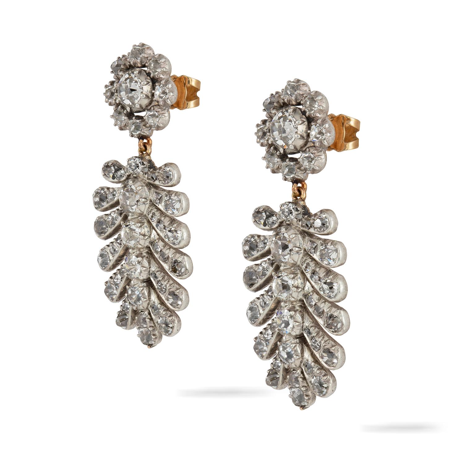 A pair of late Georgian palmette drop earrings with associated Georgian diamond cluster tops, the earrings encrusted with old-cut diamonds weighing approximately a total of 5.25 carats, all set in silver to yellow gold close back mount, with later