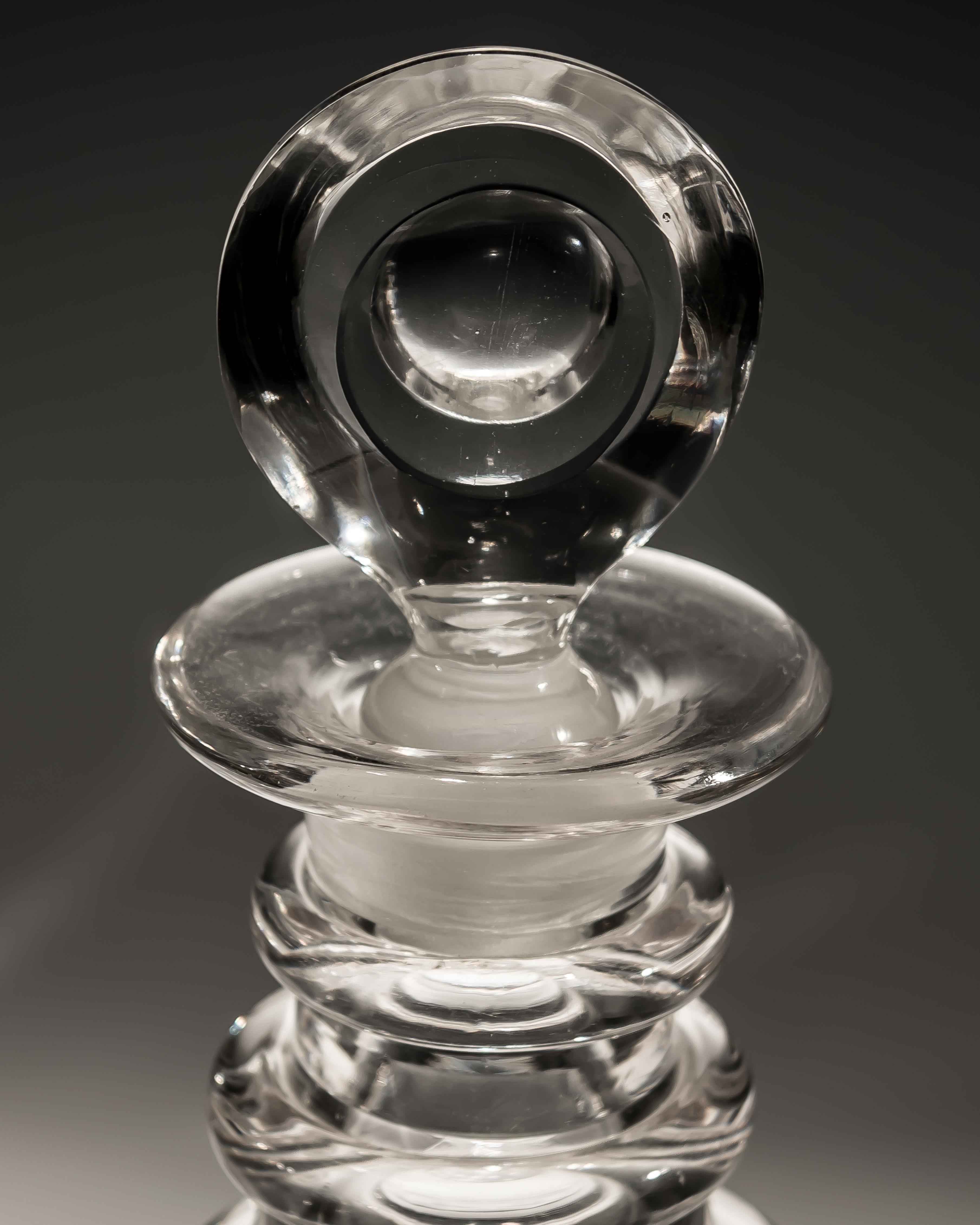 A pair of Georgian slice and flute cut decanter.