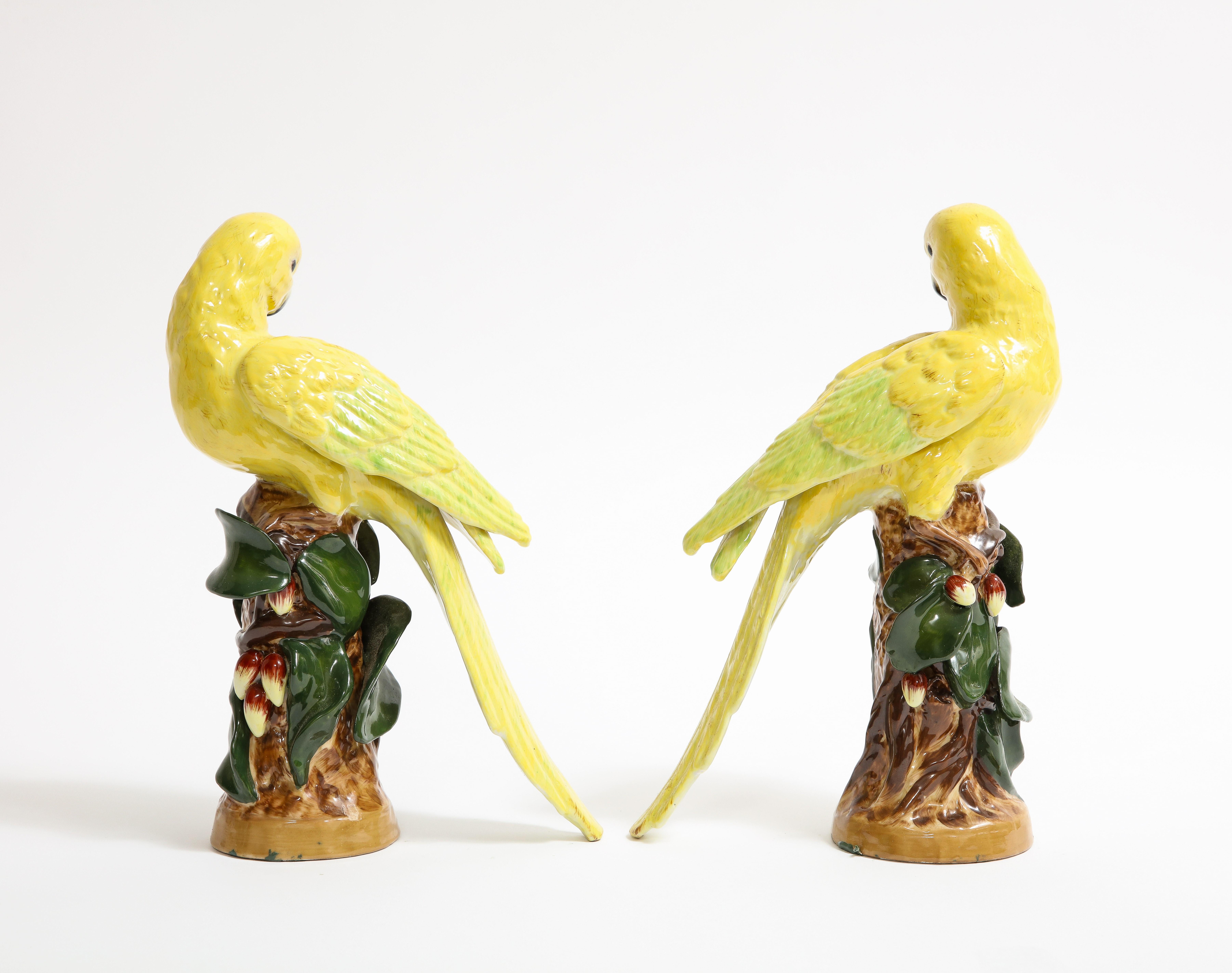 Hand-Carved Pair of German Porcelain Yellow Birds Perched on Tree Branches