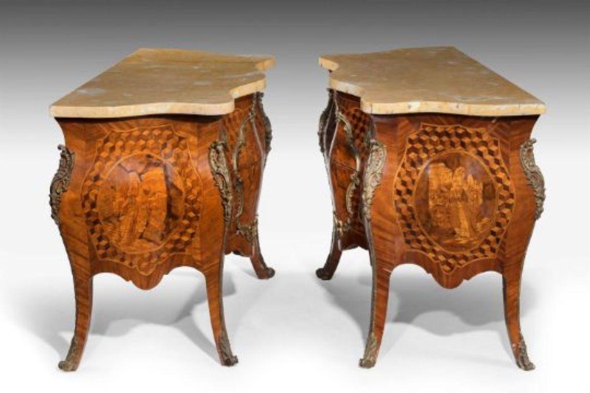 A PAIR OF GERMAN SMALL GILT METAL MOUNTED MARQUETRY AND PARQUETRY SERPENTINE COMMODES20TH CENTURY, IN THE 18TH CENTURY STYLE Each with a shaped yellow marble top above two drawers inlaid sans traverse, the front and sides with cartouches depicting