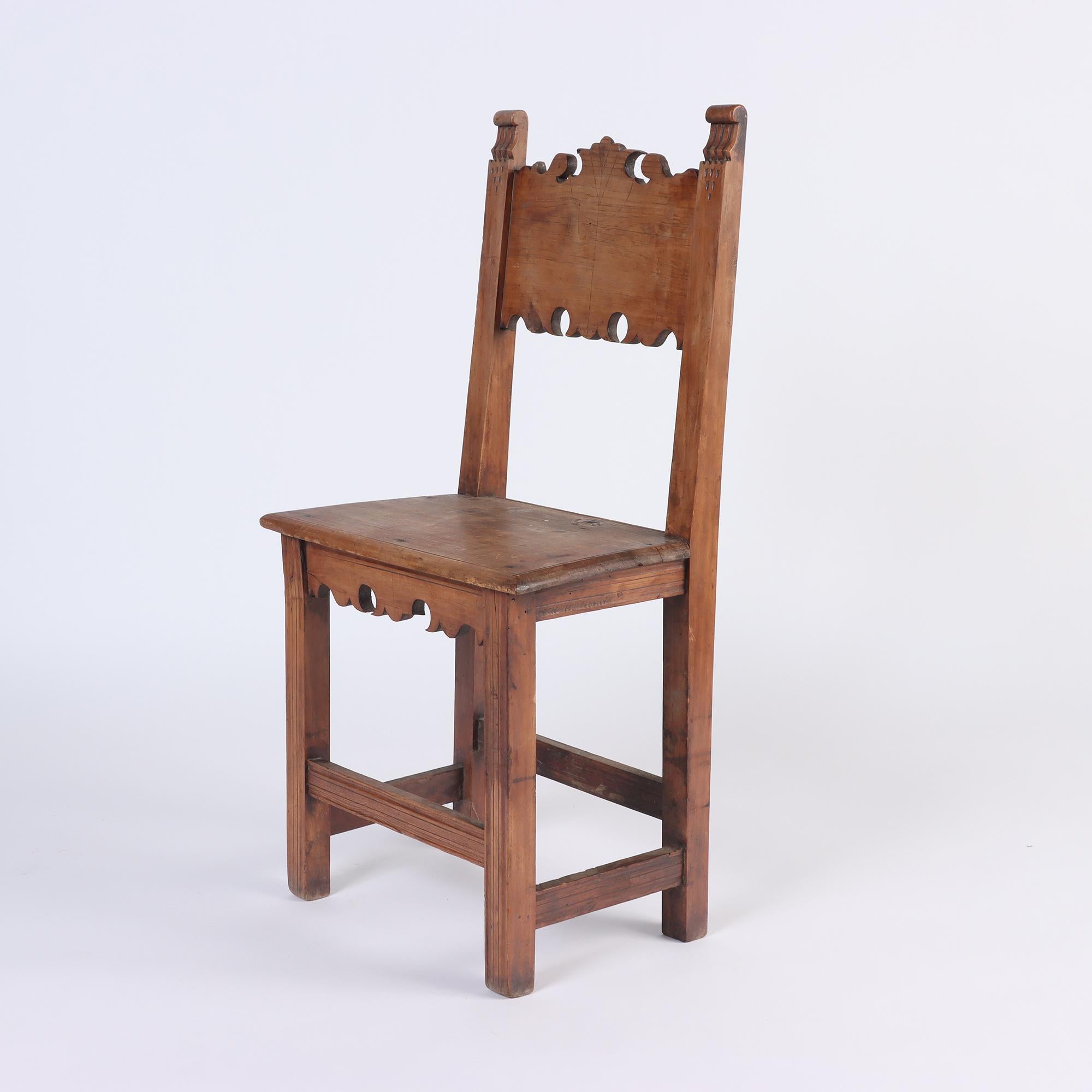 A pair of German walnut chairs with beautiful cutout backrest detail. 
 Perfect for occasional hall chairs. Lower then dining chairs.