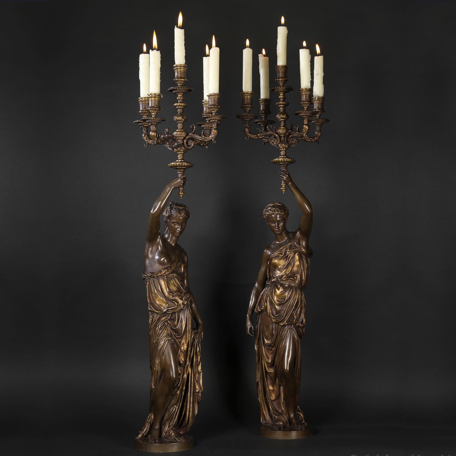 Paire de candélabres figuratifs à cinq lumières en bronze doré et patiné, fondus par Barbedienne d'après les modèles d'Alexandre Falguière et Paul Dubois. 

Signé 'FALGUIERE' et 'P. DUBOIS