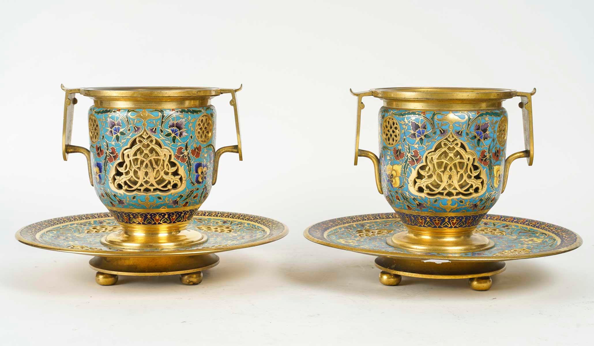 A pair of gilt bronze and enamelled goblets or cache-pots, signed F. Barbedienne, 19th century, Napoleon III period.

A pair of gilt bronze and enamelled goblets, floral design, signed F. Barbedienne, 19th century, Napoleon III period.
h: 21cm, d: