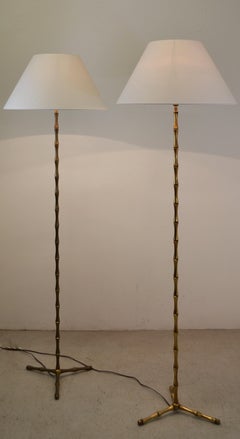 A pair of gilt bronze floor lamps by Maison Bagues. France - 1950s