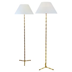 A pair of gilt bronze floor lamps by Maison Bagues. France - 1950s