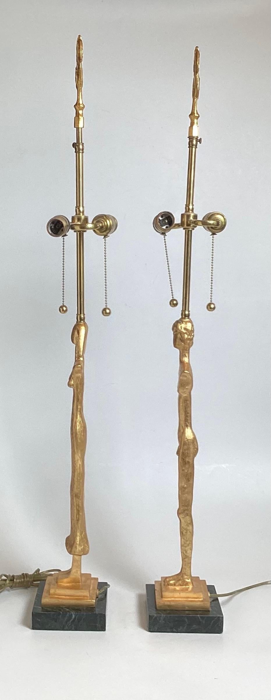A Pair of Gilt Bronze Lamps After Giacometti In Excellent Condition For Sale In Lambertville, NJ
