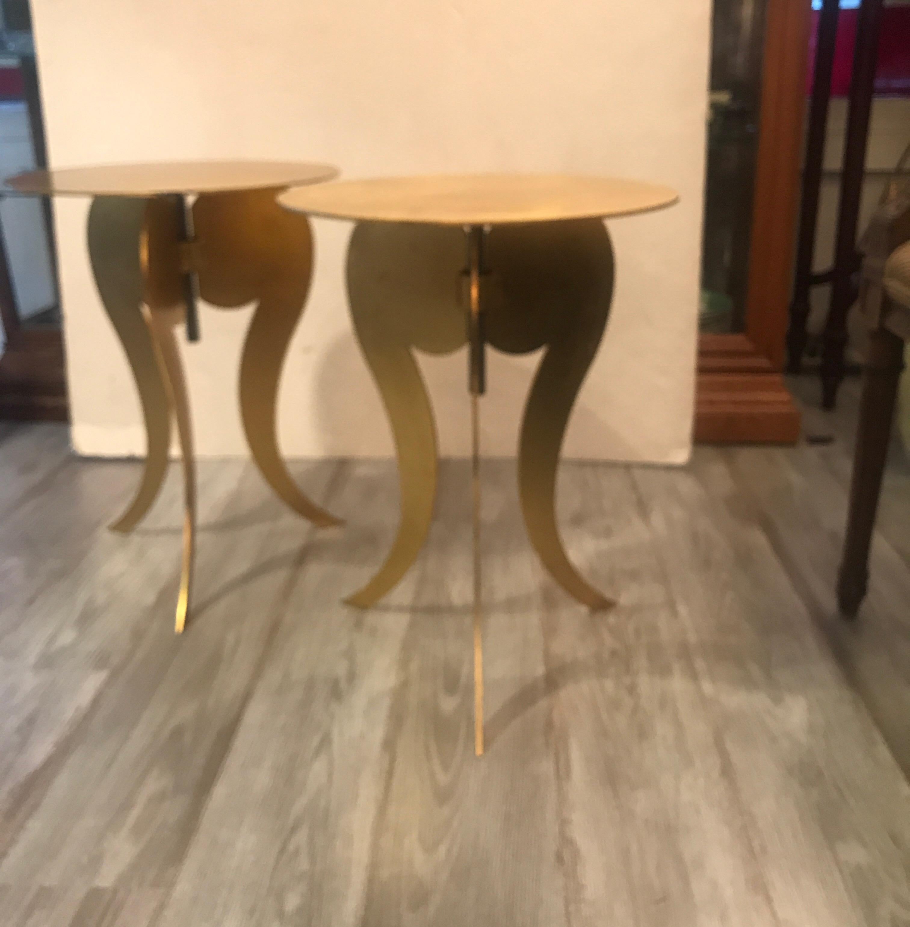 A Whimsical pair of cut and gilt steel round pedestal tables. The tables with round tops that adjust from 19.5 inches to 25.5 inches tall.
Late 20th Century Circa 1985