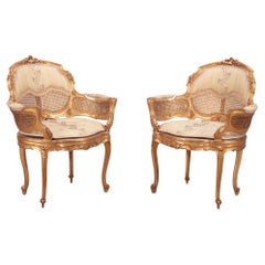 Paar vergoldete und geschnitzte französische Bergere-Stühle im Louis-XV-Stil. CIRCA 1900 