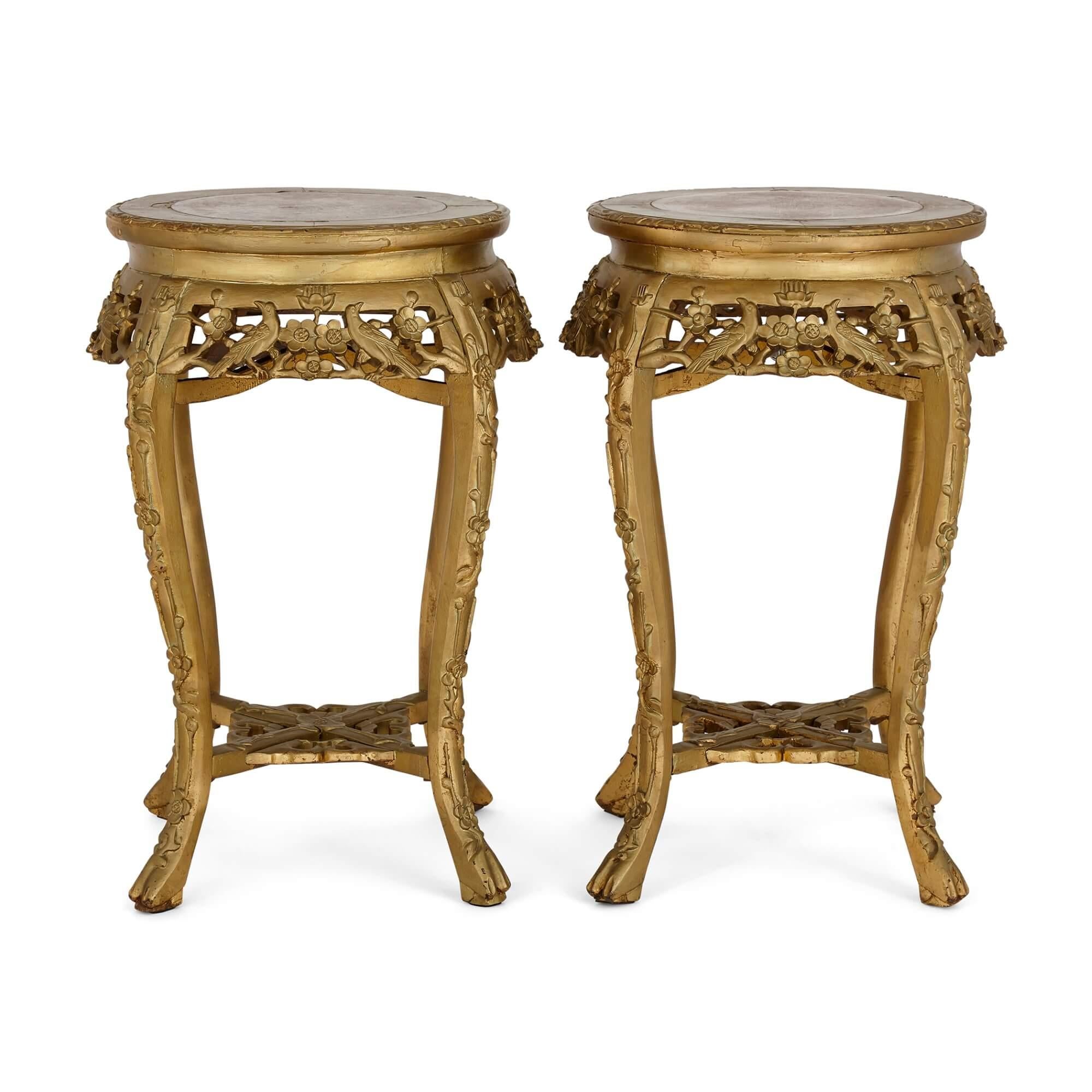 A pair of giltwood and marble-inlay stands
French, 20th century
Height 70cm, diameter 41cm

Made to complement and display luxury items such as Sevres style porcelain vases, these fine stands are French-made, and date from the early 20th