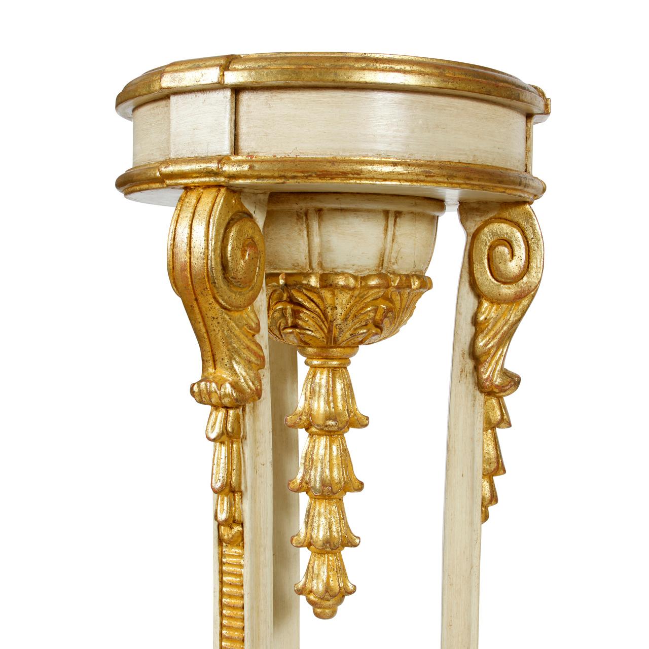 A pair of giltwood Jansen style pedestals in painted ivory wood.