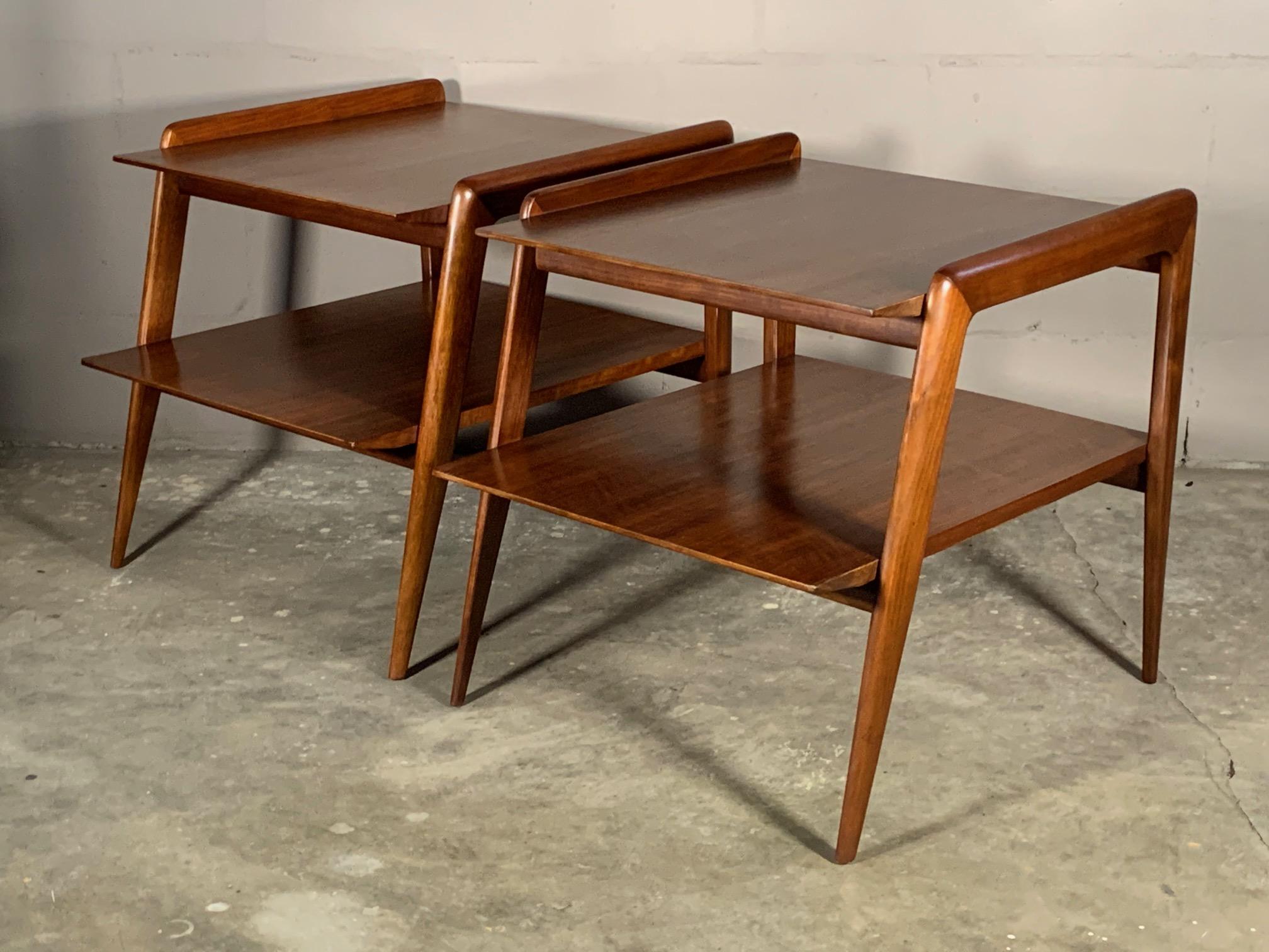 A pair of rare and beautiful occasional tables by Gio Ponti for Singer & Sons circa 1950s, model #2166. Two tiered with angular features so typical of his work. Newly restored with hand rubbed finish.