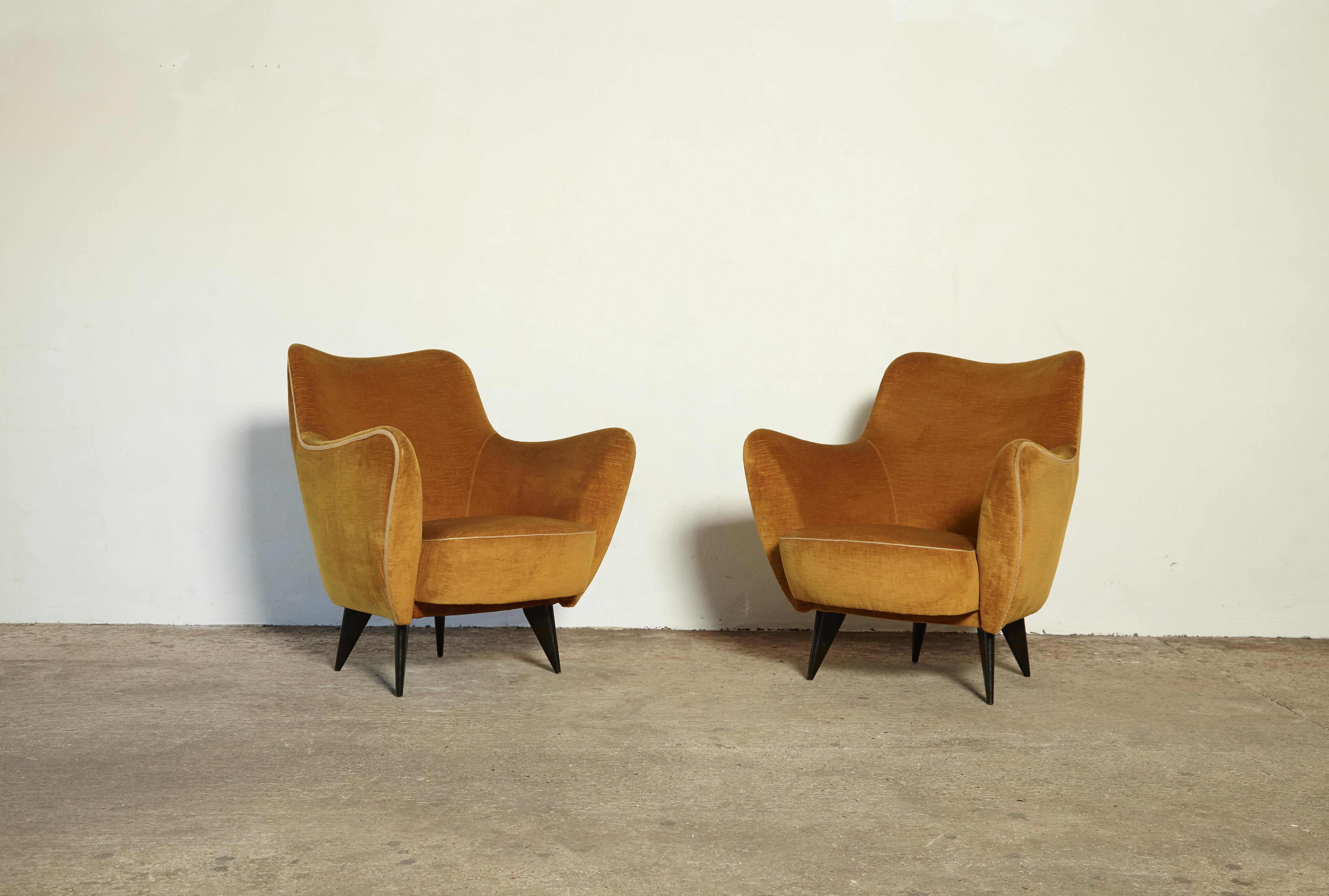 An original pair of Giulia Veronesi Perla Armchairs, I.S.A. Bergamo, Italy, 1950. The yellow/gold velour fabric and piping show some signs of wear. Recovering is possible and we can assist if required.   A pair of matching chairs is available -