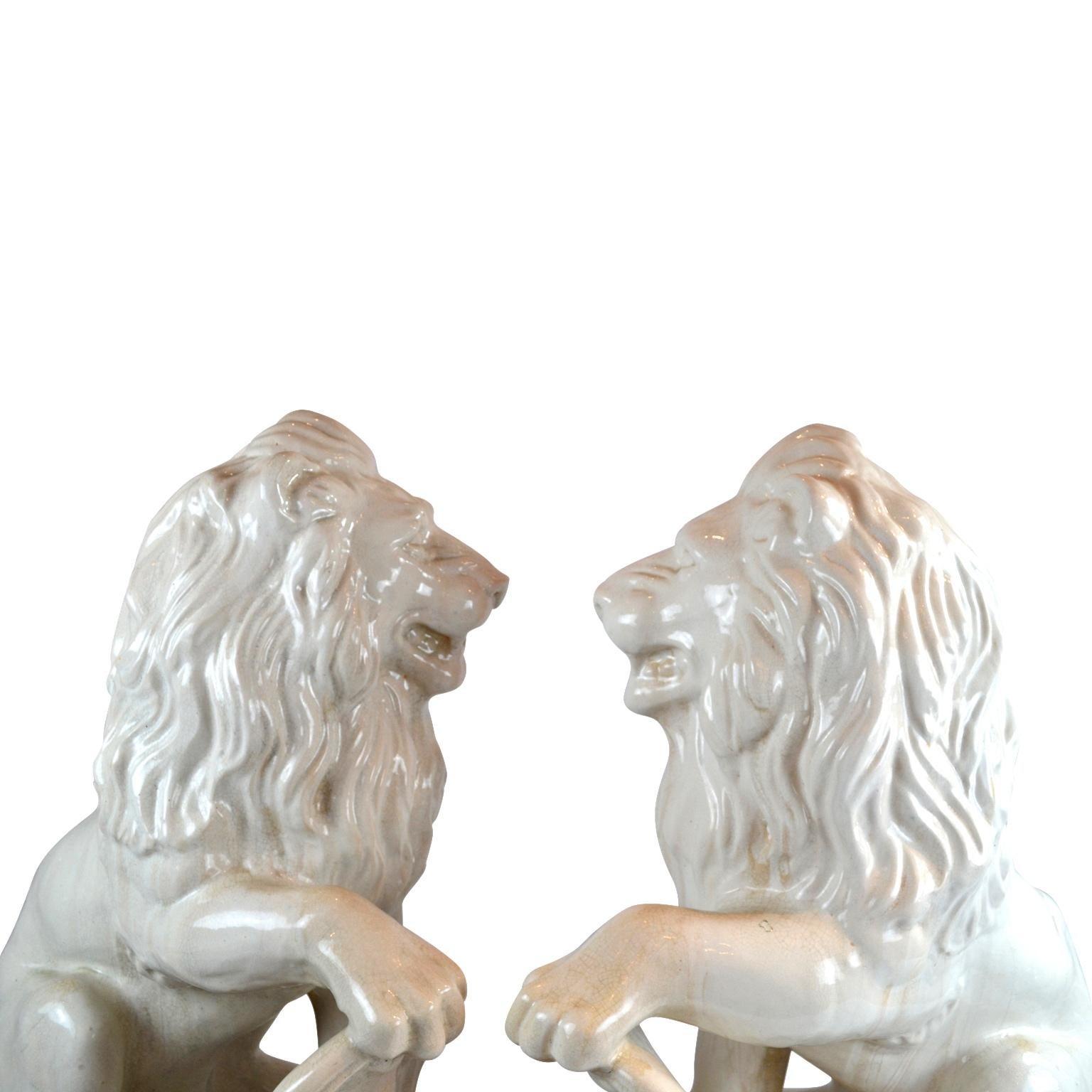 Empire Pair of Glazed Terracotta Rampant Lion Sculptures