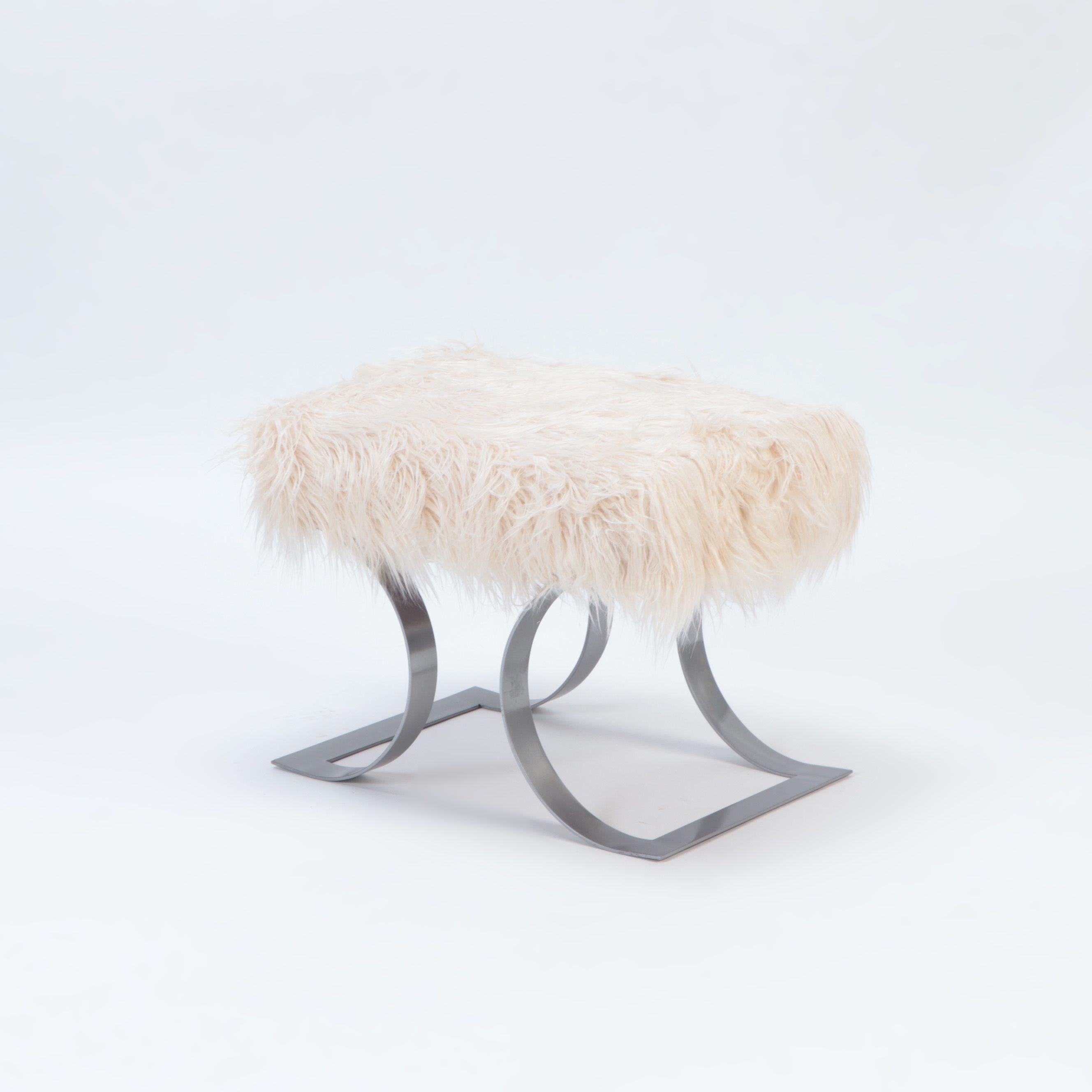 A pair of goat hair upholstered benches in the manner of Karl Springer. Contemporary.