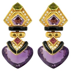 Ein Paar Ohrringe aus Gold, Amethyst, Peridot, Diamant und Onyx.