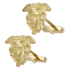 Un paio di gemelli con Medusa in oro