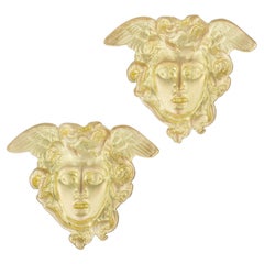 Un paio di gemelli con Medusa in oro