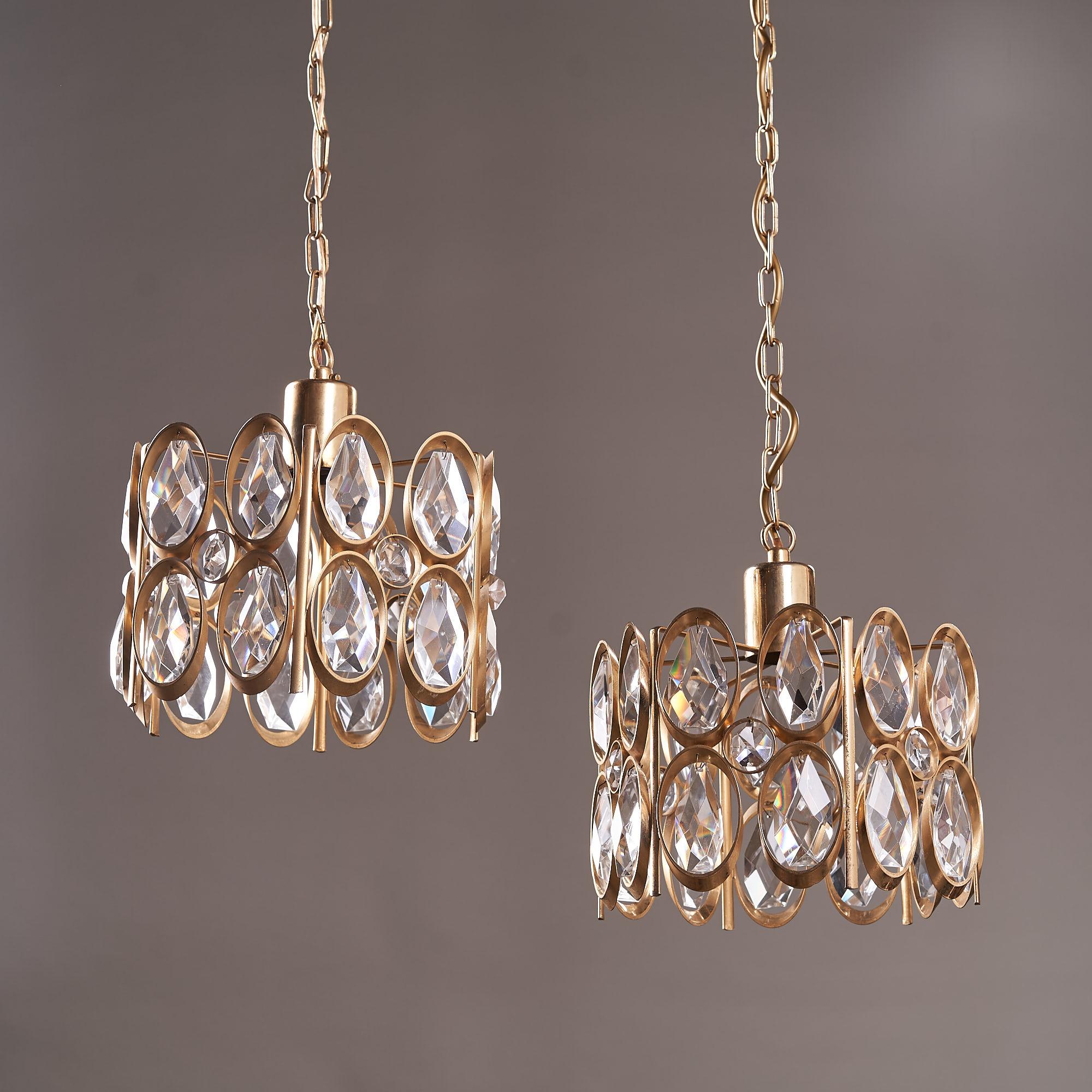 Hollywood Regency Pair of Gold-Plated Brass Framed Glass Chandeliers