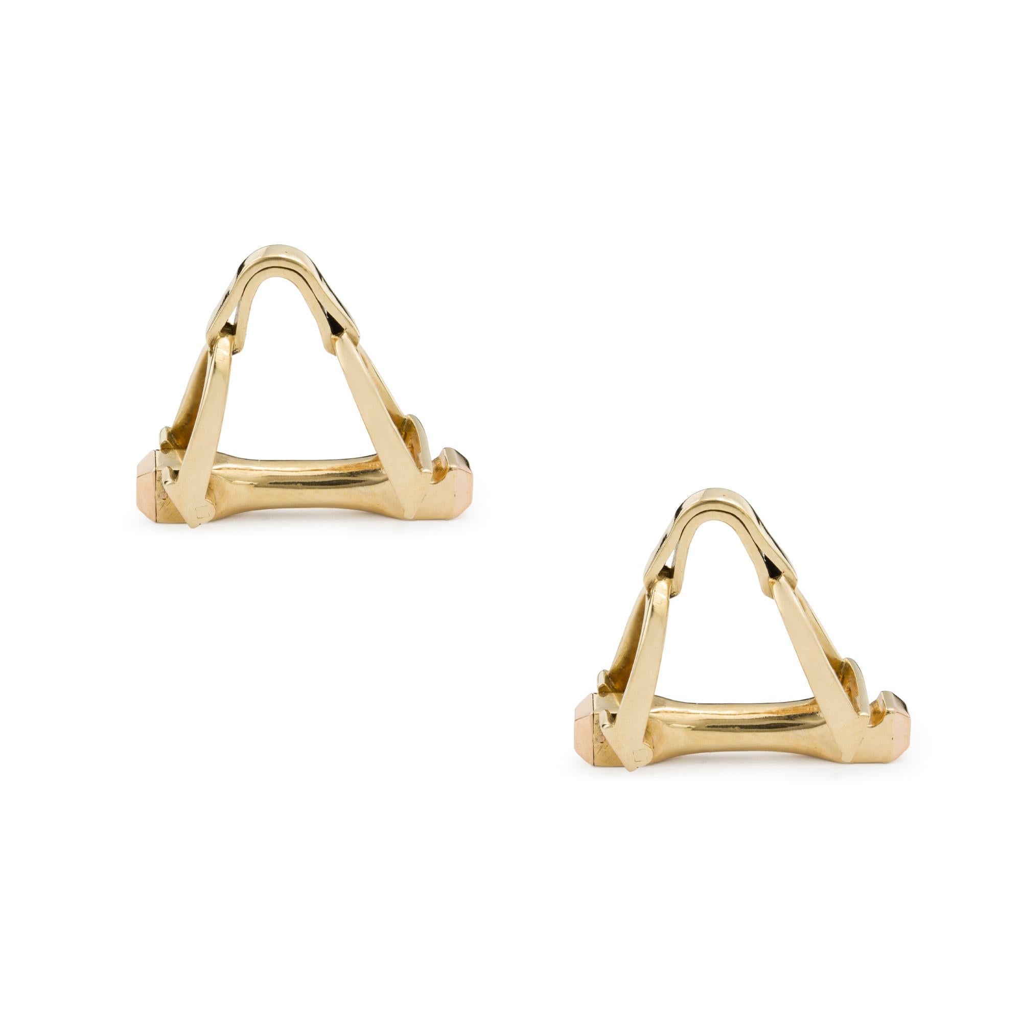 A pair of gold stirrup cufflinks, each link designed as a pair of stirrups forming a triangular link connected to a gold bar, all in yellow gold, bearing French marks, later hallmarked 18ct gold London, 2016, measuring approximately 2.4 x 1.9cm,