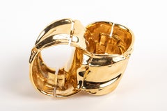 A Pair of Gold Tone Cuffs by Ciner