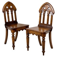 A Pair Of Gothic Oak Side Or Hall Chairs