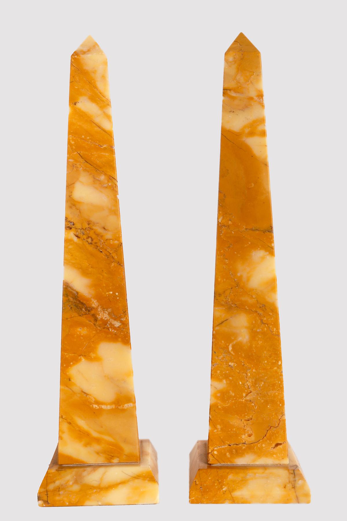 A pair of Grand Tour obelisks. Made of Siena yellow marble. Italy second half of the 19th century.