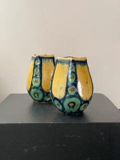 A pair of green and yellow vases